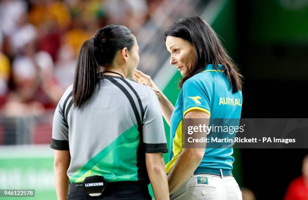 Australia head coach Sandy Brondello speaks with an official after Australia's Elizabeth Cambage is ejected in the Women's Gold Medal Game at the...