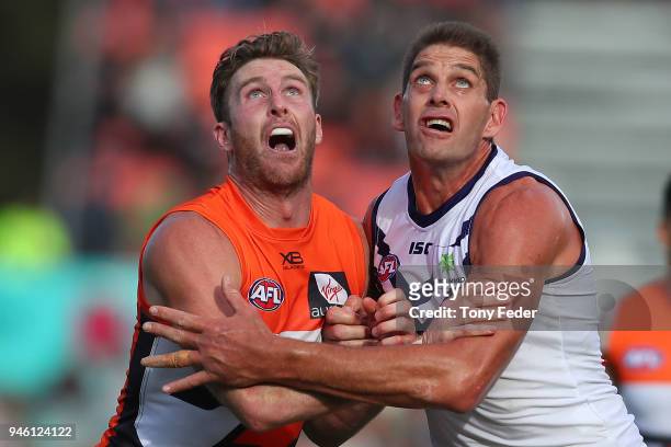Aaron Sandilands of the Dockers contests the ruck with his Giants opponent during the round four AFL match between the Greater Western Sydney Giants...