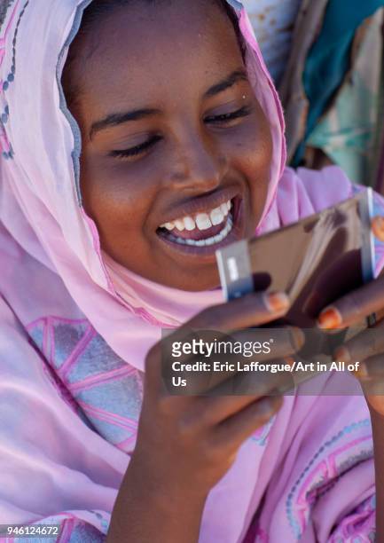 Portrait of a somali young woman dicvovering herself on a polaroid picture, North-Western province, Berbera, Somaliland on November 14, 2011 in...