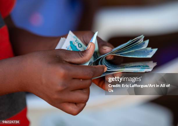 Man is counting schillings notes, Awdal region, Zeila, Somaliland on November 20, 2011 in Zeila, Somaliland.