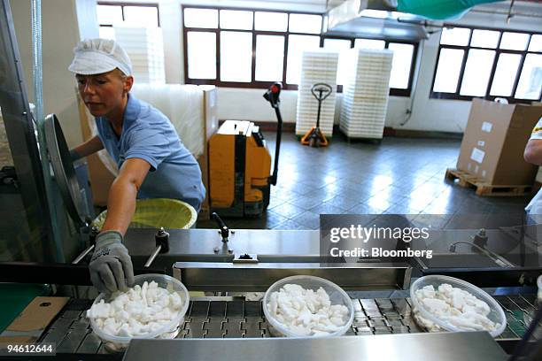 Haribo employee Yvonne Pietrek performs a quality control check on Knuddel-Knut'sch gummi candy, shaped like Knut, the baby polar bear abandoned by...