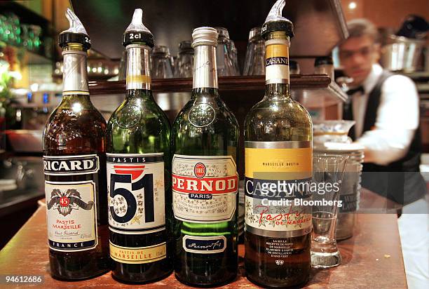 Bottles of Pernod-Ricard pastis are arranged at a cafe in Paris, France, on Friday, Sept. 28, 2007. The French grow about 30 million tons of beta...