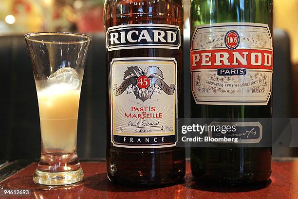 Bottles of Pernod-Ricard pastis are arranged at a cafe in Paris, France, on Friday, Sept. 28, 2007. The French grow about 30 million tons of beta...