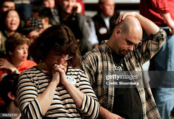 Supporters of Barack Obama, U.S. Senator from Illinois and 2008 Democratic presidential candidate, react with disappointment at a primary night rally...