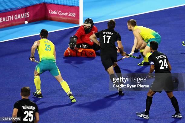 Aaron Kleinschmidt of Australia scores his sides first goal in the Men's gold medal match between Australia and New Zealand during Hockey on day 10...