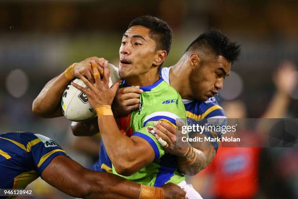 Mafoa'aeata Hingano of the Raiders is tackled during the round six NRL match between the Canberra Raiders and the Parramatta Eels at GIO Stadium on...