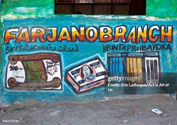 Painted bilboard advertisement for money transfer, Woqooyi Galbeed region, Hargeisa, Somaliland on November 19, 2011 in Hargeisa, Somaliland.