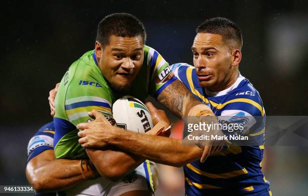 Joseph Leilua of the Raiders is tackled by Corey Norman of the Eels during the round six NRL match between the Canberra Raiders and the Parramatta...