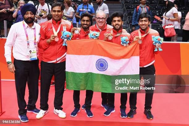 Silver medalist Sharath Achanta and Sathiyan Gnanasekaran of India and bronze medalist and Sanil Shankar Sheety and Harmeet Desai of India pose...