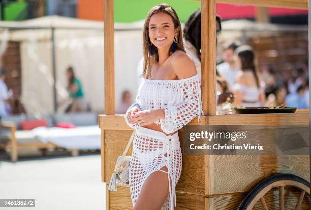 Helen Owen wearing white off shoulder net top and skirt seen at Revolve Pool Party on April 13, 2018 in Palm Springs, California.