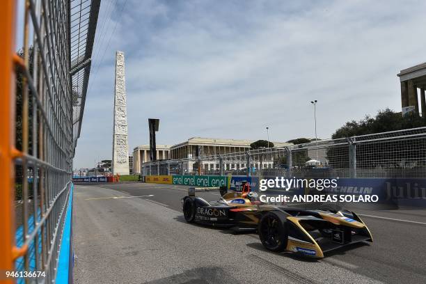 Techeetah racing team Formula E driver, German's driver Andre Lotterer steers his car past the Marconi obelisk during a qualifying session prior to...