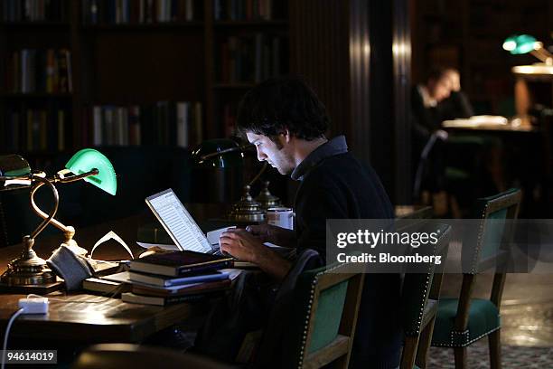 Datmouth College senior Patrick Handler of Maryland, works on his computer in the tower room of Dartmouth's Baker Library in Hanover, New Hampshire,...