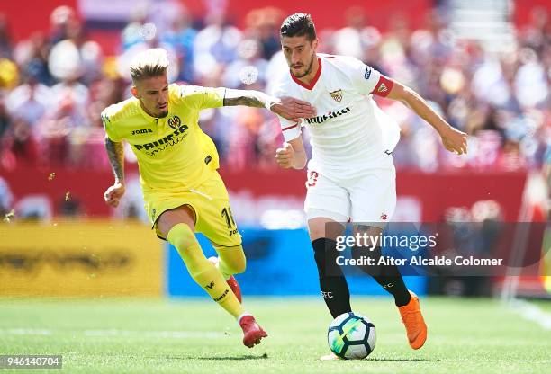 Sergio Escudero of Sevilla FC competes for the ball with Samuel Castillejo of Villarreal CF during the La Liga match between Sevilla and Villarreal...