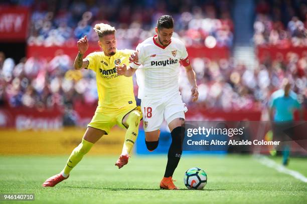 Sergio Escudero of Sevilla FC competes for the ball with Samuel Castillejo of Villarreal CF during the La Liga match between Sevilla and Villarreal...