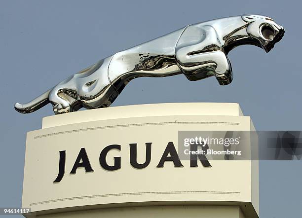 The Jaguar emblem is displayed outside a dealership in Naperville, Illinois on Friday, August 25, 2006. Ford Motor Co., restructuring after a $1.44...