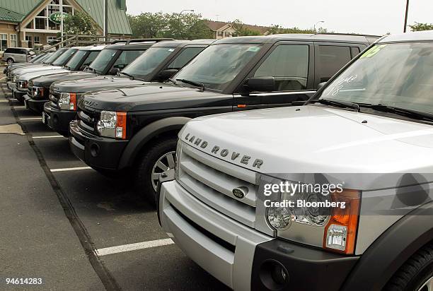 Land Rover SUV's sit on display outside of a dealership in Naperville, Illinois on Friday, August 25, 2006. Ford Motor Co., restructuring after a...