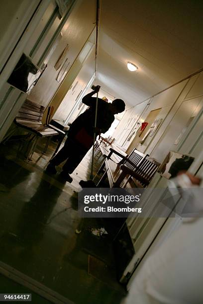 Hospital staff member sweeps the hallways of the Eben Donges Hospital in Worcester, Cape Town, South Africa, on Wednesday, Jan. 10, 2007. Patients...