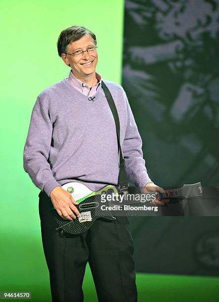 Bill Gates, chairman of Microsoft Corp., holds an Xbox 360 'Guitar Hero' game controller during his keynote address at the Consumer Electronics Show...