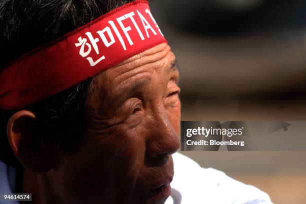 Protester takes a break during a rally against the U.S. And South Korea?s 4th Free Trade Agreement meeting in Jeju, South Korea in Wednesday, October...