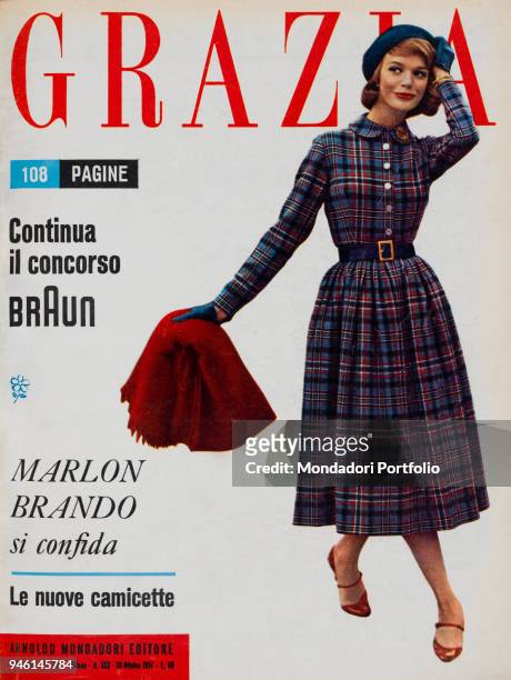 Cover of the women's magazine Grazia. A model wearing a simple and comfortable dress by FÃ©raud, perfect for the young girls. The dress is completed...
