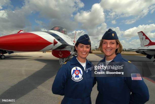 Air Force Major Nicole Malachowski of Las Vegas, Nevada, left, and Major Samantha Weeks of Rome, New York, first female fighter pilots to fly with...