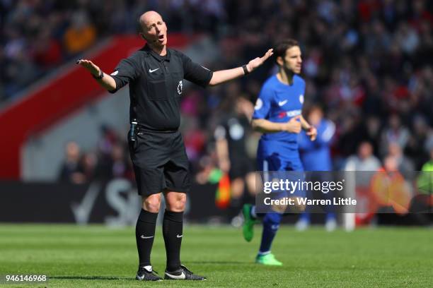 Referee Mike Dean reacts during the Premier League match between Southampton and Chelsea at St Mary's Stadium on April 14, 2018 in Southampton,...