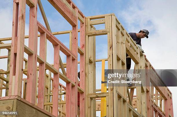 Builder works on the construction site of a new home in the Auckland region of Howick, New Zealand, on Feb. 27, 2007. Fletcher Building Ltd., the...