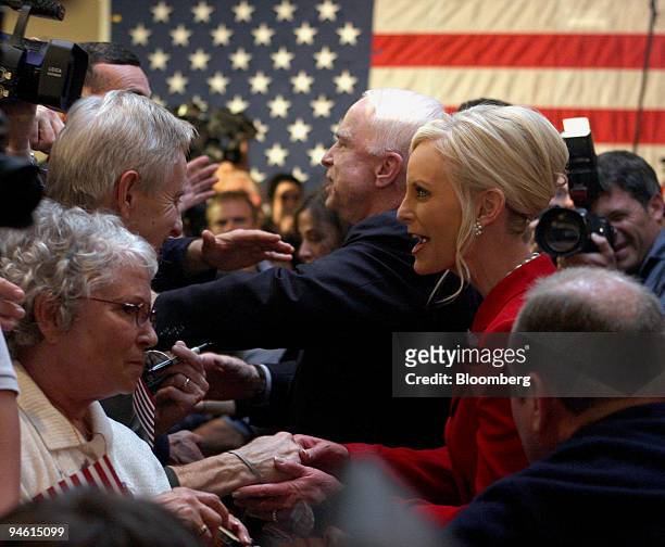 John McCain, center left, U.S. Senator from Arizona and 2008 Republican presidential candidate, and his wife Cindy McCain, center right, thank...