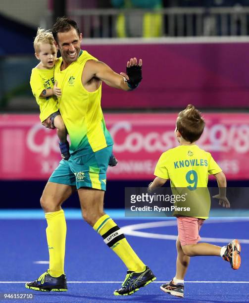 Mark Knowles of Australia celebrate victory with his family in the Men's gold medal match between Australia and New Zealand during Hockey on day 10...