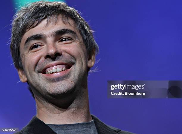 Larry Page, co-founder of Google Inc., stands on-stage with others pledging to conduct a dozen global competitions for large scale inducement prizes...