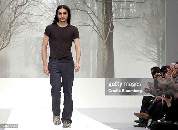 Belgian fashion designer Olivier Theyskens salutes the audience at the end of the presentation of his Fall/Winter 2007-2008 ready-to-wear collection...