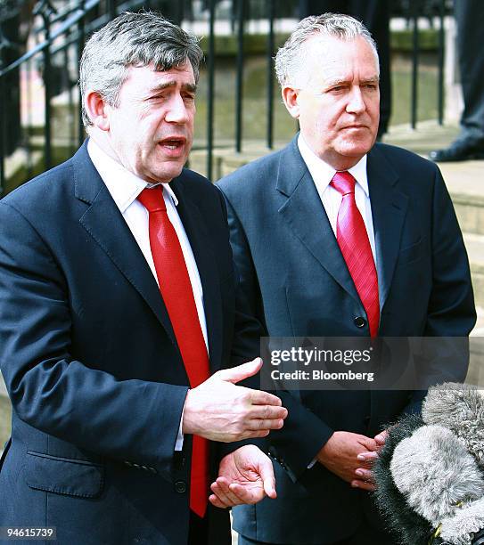 Chancellor of the Exchequer, Gordon Brown, left, and Minister for Northern Ireland, Peter Hain speak to the media outside the Scottish Office after...