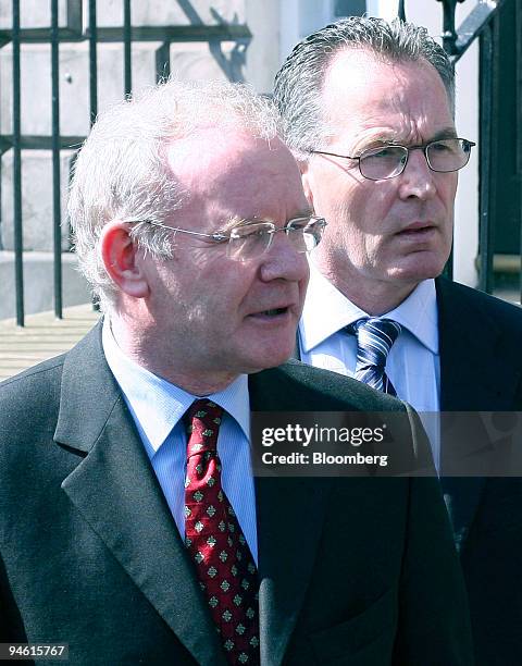Sinn Fein's, Martin McGuinness, left, and Gerry Kelly speak to the media outside the Scottish Office after meetings with UK Chancellor of the...