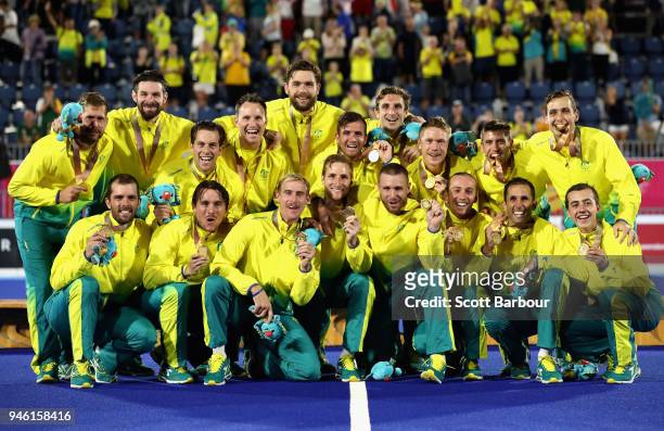 Australia celebrate their gold medal on the podium following the Men's gold medal match between Australia and New Zealand during Hockey on day 10 of...