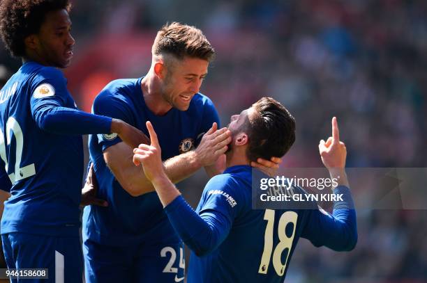 Chelsea's French attacker Olivier Giroud celebrates scoring their third goal with team-mates Chelsea's Brazilian midfielder Willian and Chelsea's...