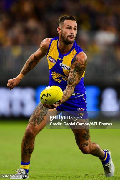 Chris Masten of the Eagles handpasses the ball during the 2018 AFL Round 04 match between the West Coast Eagles and the Gold Coast Suns at Optus...