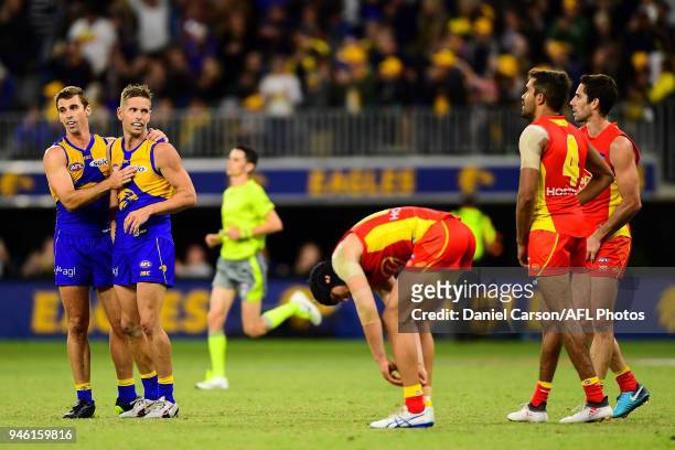 Jamie Cripps and Mark LeCras of the Eagles celebrate the win on the final siren during the 2018 AFL Round 04 match between the West Coast Eagles and...