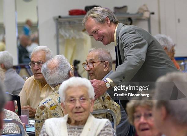 Republican Senator Lincoln Chafee of Rhode Island, standing, speaks with seniors during a campaign stop at the Woonsocket Senior Center Thursday,...