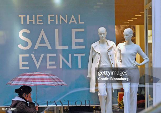 Pedestrian passes a sale sign in the window of an Ann Taylor store New York, U.S., on Thursday, Dec. 27, 2007. Spending surges after the Thanksgiving...