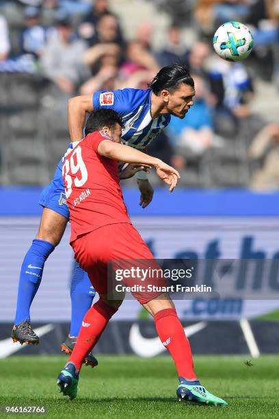 Claudio Pizarro of Koeln fights for the ball with Karim Rekik of Berlin during the Bundesliga match between Hertha BSC and 1. FC Koeln at...