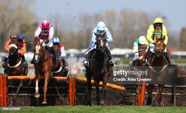 Black Op ridden by Noel Fehily clears the last fence on their way to winning the Betway Mersey Novices' Hurdle Race at Aintree Racecourse on April...