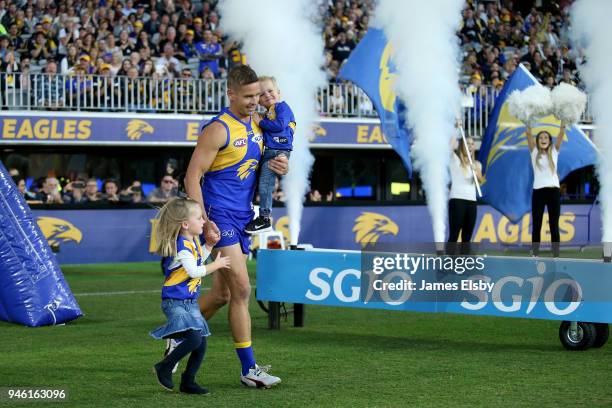 Mark LeCras of the Eagles runs out for his 200th game during the round four AFL match between the West Coast Eagles and the Gold Coast Suns at Optus...