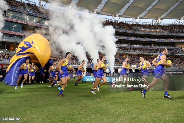 The Eagles run out during the round four AFL match between the West Coast Eagles and the Gold Coast Suns at Optus Stadium on April 14, 2018 in Perth,...