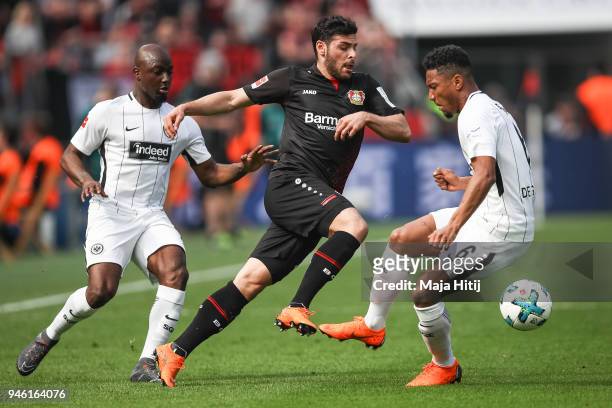 Kevin Volland of Bayer Leverkusen battle for the ball with Jetro Willems of Eintracht Frankfurtand Jonathan de Guzman of Eintracht Frankfurt the...