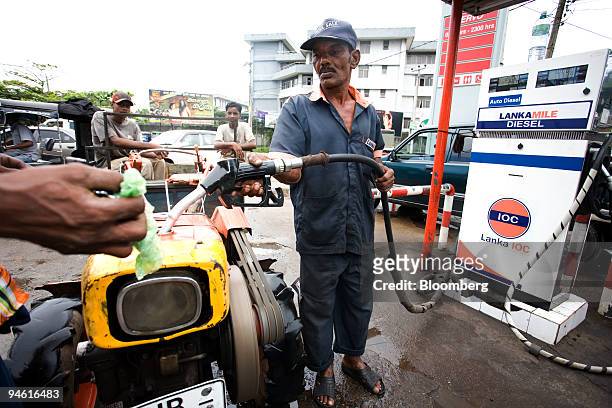 Tractor is filled up with petrol at an Indian Oil Co. Petrol station in Colombo, Sri Lanka, on Monday, Sept. 24, 2007. Ceylon Petroleum Corp., Sri...