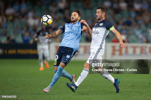 Milos Ninkovic of Sydney FC controls the ball in this challenge by Melbourne's Carl Vaeri during the round 27 A-League match between the Sydney FC...