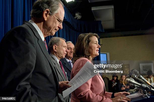 Representative Michael Castle, a Republican from Delaware, reviews notes while Representative Diana DeGette, a Democrat from Colorado, speaks at a...