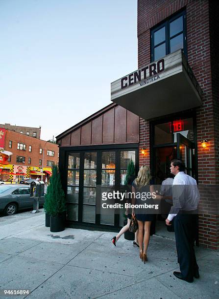 Patrons enter Centro I Vinoteca, an Italian bistro in the West Village neighborhood of New York, on Aug. 2, 2007.