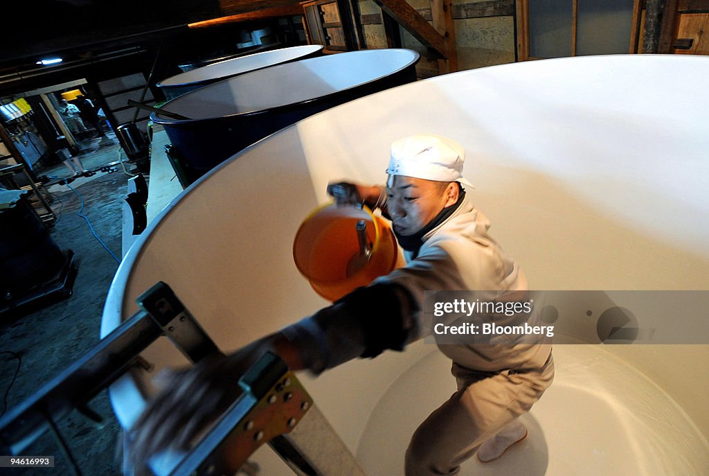 A brewery worker climbs out of a 4000 liter tank used in the