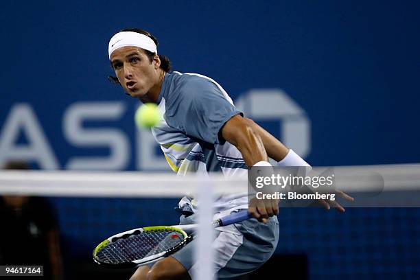 Feliciano Lopez of Spain returns to Roger Federer of Switzerland during their fourth round match on the eighth day of the U.S. Open at the Billie...